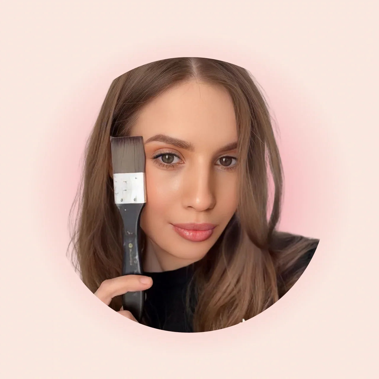 Woman with long brown hair holding paintbrush to face, pink background, mysilence art acrylic art piece